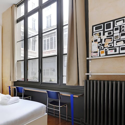 Catch up on emails from the bedroom's handy workspace