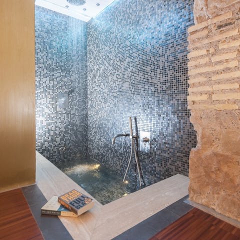 Have a bit of me-time in the luxurious bath with attached rain shower