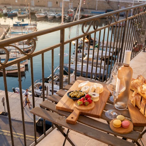 Admire the wonderful views of the harbour from the balcony