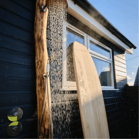 Wash off the sand and salt in the hot outdoor shower