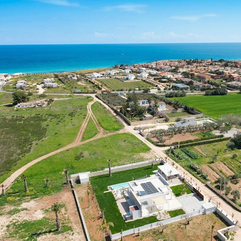 Stroll to the stunning sandy beach nearby