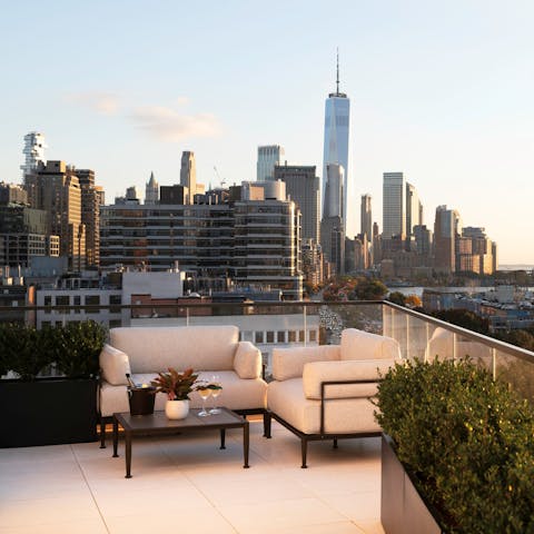 Savour views of New York City from the communal terrace