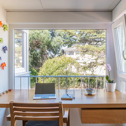 Work remotely with a calming view of the leafy communal garden