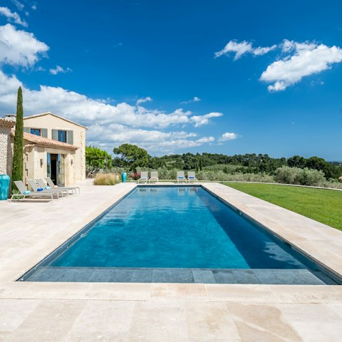 Soak up the sunshine by the swimming pool