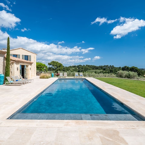 Soak up the sunshine by the swimming pool