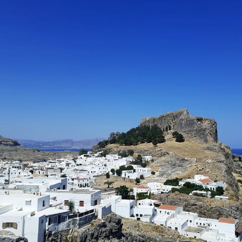 Visit beautiful Lindos, with its charming streets and its stunning Acropolis, a twenty-minute drive away