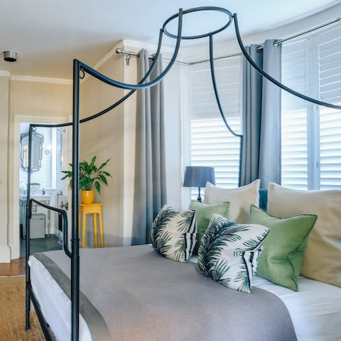 Fall asleep in the dreamy modern four-poster bed