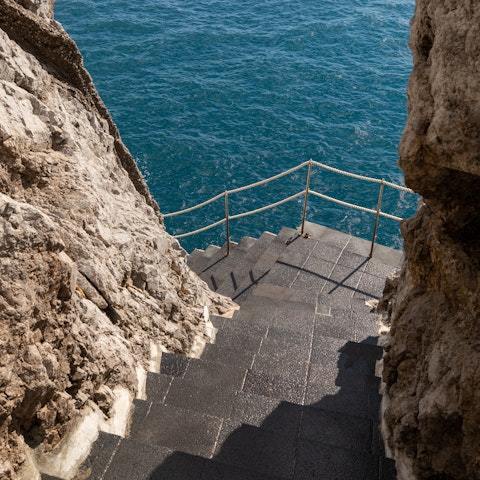 Climb down the stairs and enjoy a dip in the sea