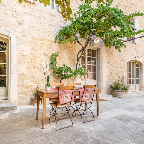 Share a bottle of local wine in the courtyard