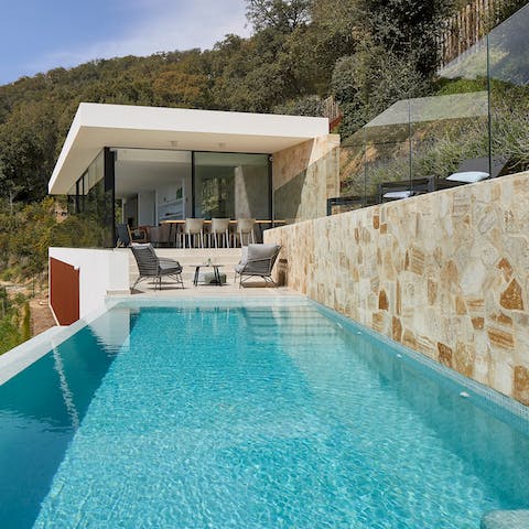 Sink into the sparkling infinity pool for some respite from the Spanish heat