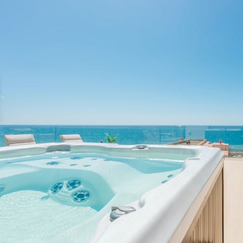 Unwind in your private Jacuzzi and take in the sea views