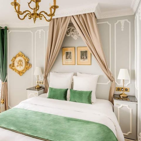 Sleep like royalty in the elegant mint green master bedroom