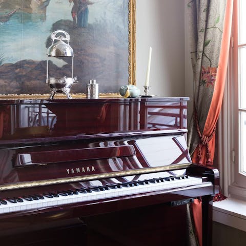 Play a few tunes on the piano in the sitting room