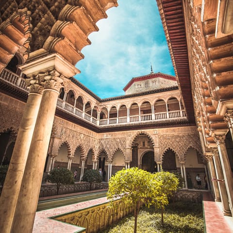 Admire the Real Alcázar de Sevilla, 850 metres away