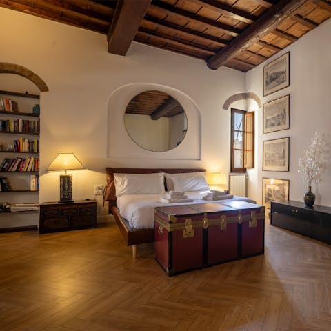 Unwind in the spacious bedroom area after exploring the city