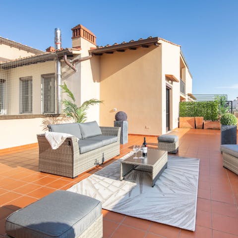 Pour a glass of wine and enjoy the sunshine on the terrace