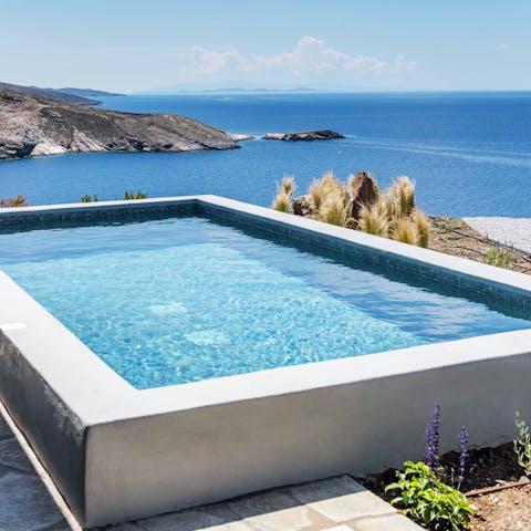 Admire wide-sweeping Aegean Sea views from the private tub