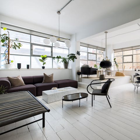 Kick back and relax in the bright open-plan living room with a glass of wine