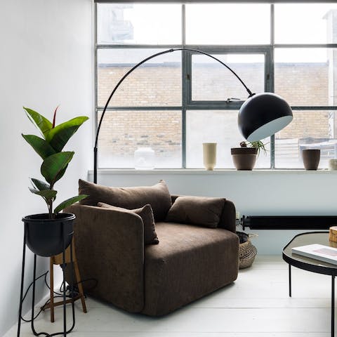 Curl up with a good book in the bedroom's comfy armchair