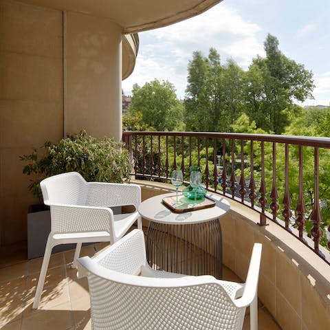 Sip your sundowner on the curved terrace