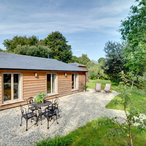 Start sunny mornings with an alfresco breakfast before retiring to the deck chairs with a good book