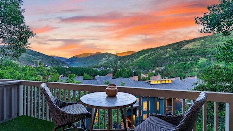 Watch dusk settle across the peaks from the balcony