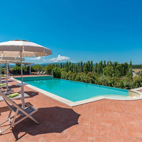 Enjoy total relaxation while lounging by the pool