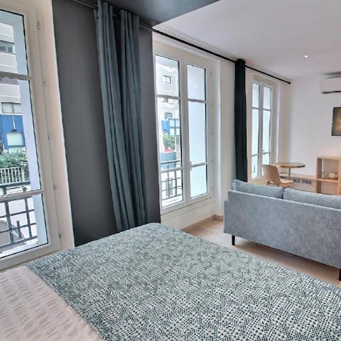 Throw open the tall windows in the open living space to let in a cooling breeze