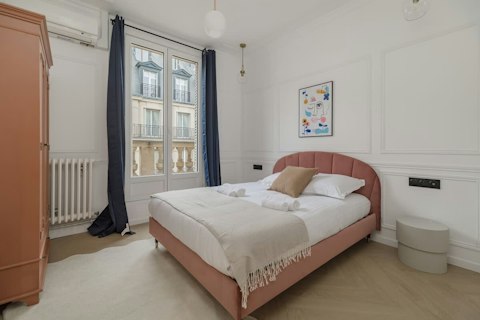 Wake up to classic Parisian rooftops from the comfortable bed