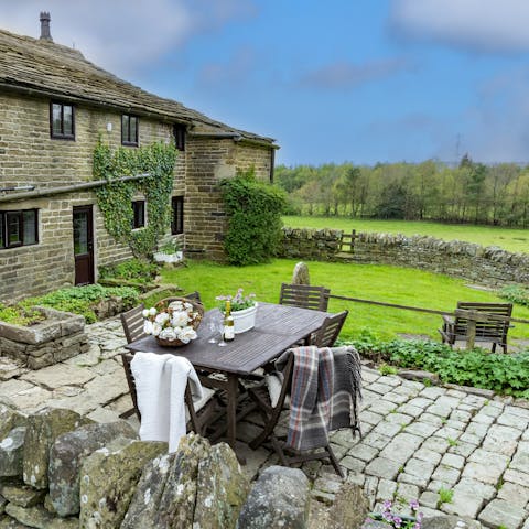 Dine out together on your alfresco dining set, located in your cute garden