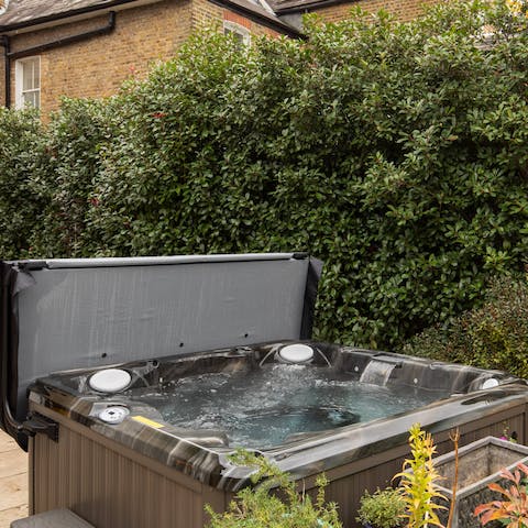 Relax and unwind in the hot tub with a glass of prosecco