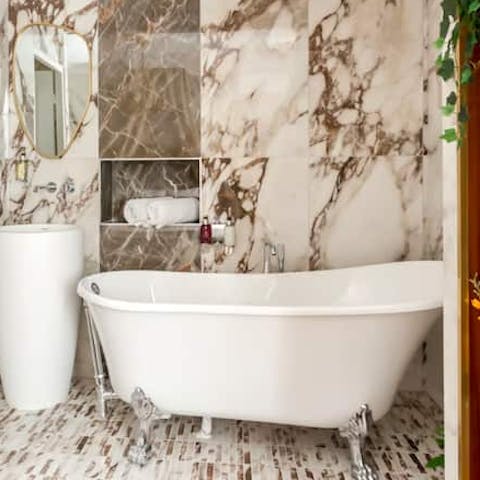 Have a long soak in the clawfoot bath before an evening out in the City of Love