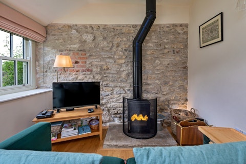 Warm up by the log burner on cooler countryside evenings
