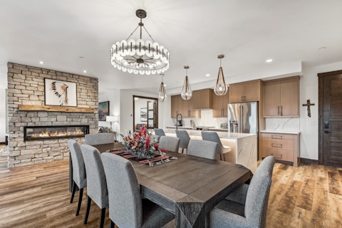 Gather round the dining table with the fireplace lit