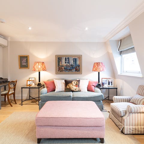 Relax in the bright living area with a glass of wine after a busy day of exploring