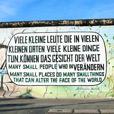 Visit the East Side Gallery, twenty-five minutes on foot from your door