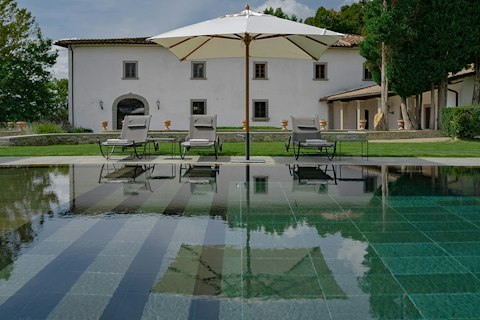 Lounge in the sun by the swimming pool