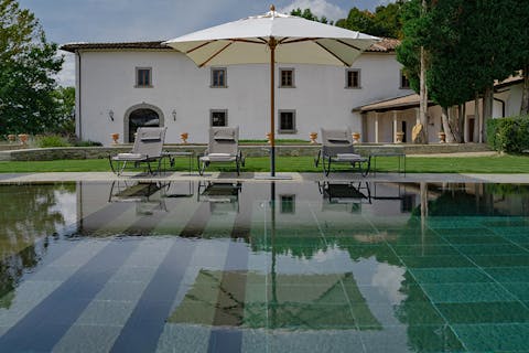 Lounge in the sun by the swimming pool