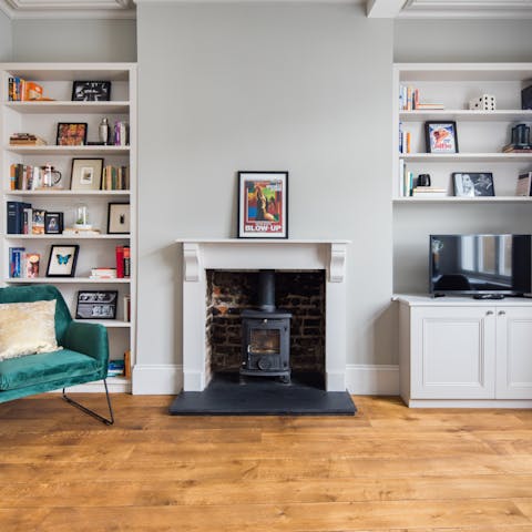 Light the living room's fire on cooler evenings
