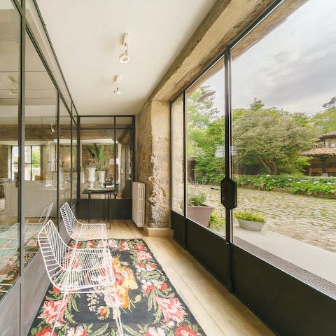 Pour a glass of wine and sit down to chat and admire the garden