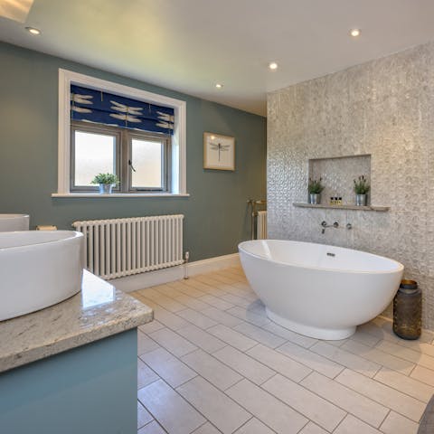 Run yourself a steamy bath in the egg-shaped freestanding tub