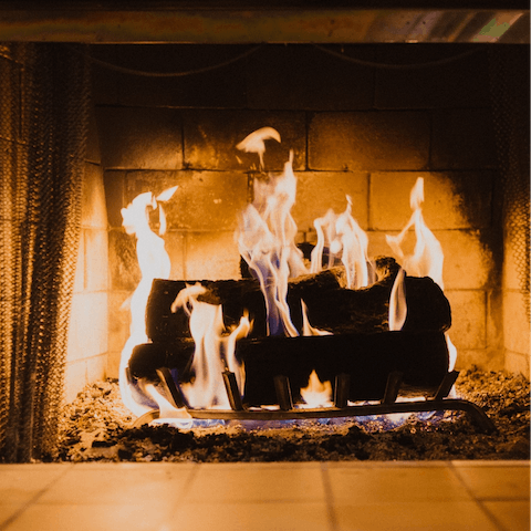 Snuggle up on the sofa beside the fireplace