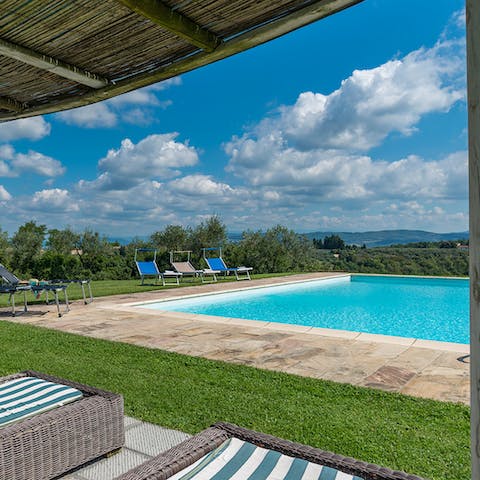 Dive in for a wake up swim, then stretch out on a sun lounger and relax