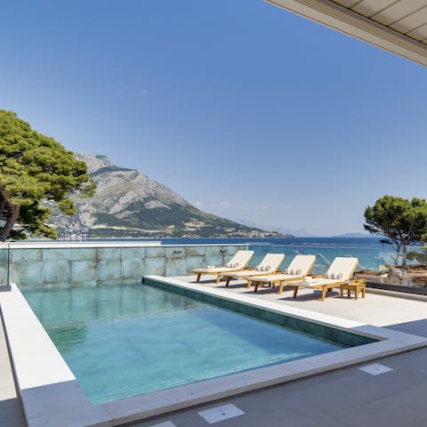 Spend dreamy days relaxing by the pool, occasionally taking dips to cool off