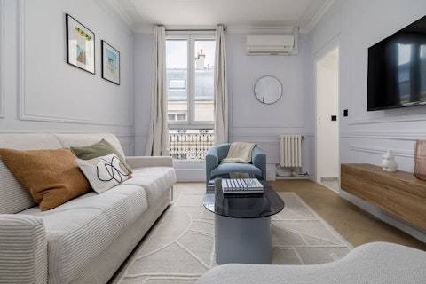 Settle into a calm, light-filled living space with classic Haussmann bones