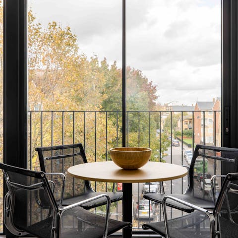 Work from home at the dining table while admiring the street views