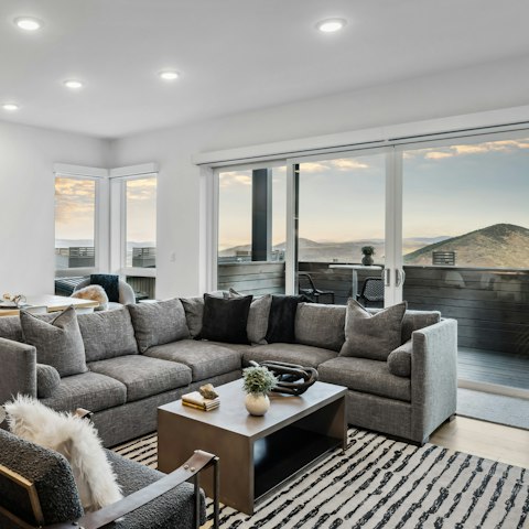 Admire the beautiful mountain views from the living room