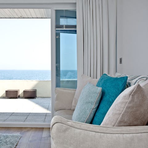 Slide open the glass doors to let the ocean breeze into the living room