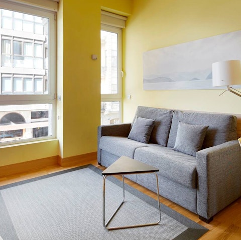 Relax beside the floor to ceiling windows
