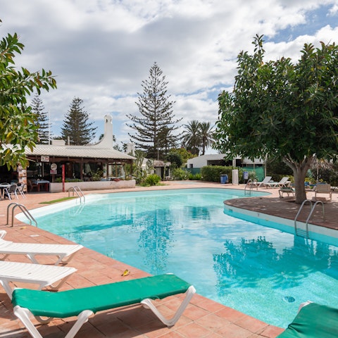 Relax around the communal pool before heading out for the day exploring